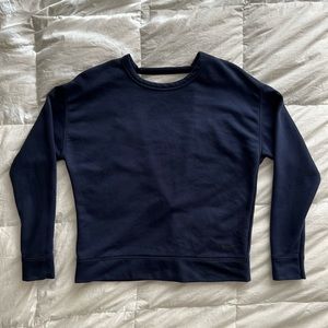 Nike, loose fit casual V open back sweater. Size S. Color: navy blue.